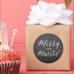 Merry And Married Black Chalkboard Holiday Wedding Classic Round Sticker<br><div class="desc">Designed by fat*fa*tin. Easy to customise with your own text,  photo or image. For custom requests,  please contact fat*fa*tin directly. Custom charges apply.

www.zazzle.com/fat_fa_tin
www.zazzle.com/color_therapy
www.zazzle.com/fatfatin_blue_knot
www.zazzle.com/fatfatin_red_knot
www.zazzle.com/fatfatin_mini_me
www.zazzle.com/fatfatin_box
www.zazzle.com/fatfatin_design
www.zazzle.com/fatfatin_ink</div>