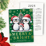 Merry Bright Fun Penguins Green Red Gold Christmas Foil Holiday Card<br><div class="desc">Create a stylish personalised Christmas card with a festive design that features a cute family of penguins in red Santa hats near a Christmas tree, golden yellow snowflakes and stars on a green background. This design has many real foil elements on the front side that makes this card unique and...</div>