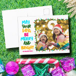 Merry Bright Pink Blue Christmas Lights Photo Holiday Postcard<br><div class="desc">Cute and cheerful family photo holiday postcards featuring a colourful strand of Christmas lights wrapped around your kids photograph. May Your Days Be Merry and Bright written in bold letters from light blue to your family name in hot pink. A rainbow of colours for the holidays.</div>