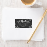 Merry Christmas Black Chalkboard Snowflake Label<br><div class="desc">Elegant white "merry christmas" script with decorative flourishes and scattered snowflakes brings rustic charm to this black chalkboard-style return address label. Hand-lettered typography brings timeless holiday character. Personalise with your family name and address for Christmas card mailings. A festive finish for every holiday envelope.</div>