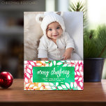 Merry Christmas Botanical Cheery Tie Dye - Photo Holiday Postcard<br><div class="desc">Add a family photo to this bright and cheery tie dye botanical non-traditional design. This can be used for any Christmas greeting - happy holidays, season's greetings and more. The front includes a photo with a trendy script font. The background includes a modern botanical pattern over a colourful red and...</div>