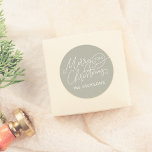 Merry Christmas Calligraphy Elegant Sage Green  Classic Round Sticker<br><div class="desc">Add an elegant touch to your holiday gifts and cards with this boho green round “Merry Christmas” sticker. Featuring “Merry Christmas” in graceful script lettering with delicate flourishes, the year is nestled inside one of the swirling details and your family name is below. The boho soft sage green background gives...</div>