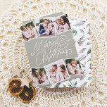 Merry Christmas Calligraphy Sage Green 6 Photos Holiday Card<br><div class="desc">Spread holiday cheer with this charming sage green Christmas photo card! The front features “Merry Christmas” in playful handwritten calligraphy, with your family name and the year tucked into one of the flourishes. Add a personal touch with six custom photos — three at the top and three at the bottom...</div>