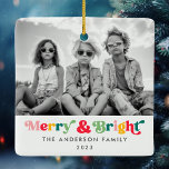 Merry Christmas colourful retro font photo Ceramic Ornament<br><div class="desc">Square ornament featuring the text "Merry & bright" in a colourful,  retro font and customisable family name and year.</div>