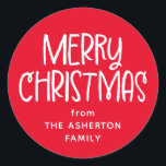 Merry Christmas cute fun red family name Classic Round Sticker<br><div class="desc">This fun festive Christmas sticker features a playful Merry Christmas in white on red and room for your custom text. You can personalise this cute holiday gift sticker with who the gift is from or another message. Find more matching cards, gift wrap and more in a variety of colours and...</div>