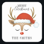 Merry Christmas Cute Reindeer Square Sticker<br><div class="desc">A cute and whimsical reindeer face with a Santa hat decorates this square sticker with the words Merry Christmas. Fun for your holiday gifts. Personalise it with your name. Designed for you by Blackberry Boulevard.</div>