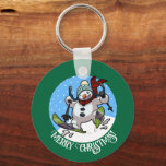 Merry Christmas! Editable Text Skiing Snowman Key Ring<br><div class="desc">A keychain or key ring can make a great Christmas stocking filler or small gift; featuring a cartoon of a jolly snowman with a carrot nose and coal eyes, dashing through the snow on skis, in woolly winter hat and tartan scarf. An upbeat image for Xmas or throughout the winter....</div>