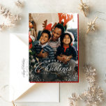 Merry Christmas elegant one photo snow frame Holiday Card<br><div class="desc">"Merry Christmas" in an elegant type treatment sits atop of a single vertical photo framed with a snowy speckle. This classic card is the perfect way to send Christmas greetings to friends and family. The back is a festive red speckled with a coordinating snowy pattern. The red color can be...</div>