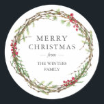 Merry Christmas Family Name Winter Greenery  Classic Round Sticker<br><div class="desc">Merry Christmas sticker with your family name in elegant modern typography and a classic stylish winter greenery wreath with red berries. Simply add your name. Exclusively designed for you by Happy Dolphin Studio. If you need any help or matching products please contact us through our store.</div>