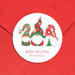 Merry Christmas Gnomes Cute Personalised Classic Round Sticker<br><div class="desc">Cute personalised holiday mailing or gift wrapping stickers featuring three Scandinavian-style gnomes with a seasonal red and green hats. You can easily personalise the "Merry Christmas" greeting and your name at the bottom.</div>