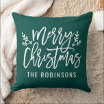 Merry Christmas Green Modern Custom Family Cushion<br><div class="desc">Seasonal pillow design features a modern brushed script "Merry Christmas" with white custom text that can be personalised with your last name. Illustrated branches of holly leaves and berries accent the design. Emerald green background colour can be modified.</div>