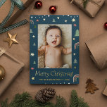 Merry Christmas Modern Scandi Blue Custom photo Foil Holiday Card<br><div class="desc">Show off a memorable family photo by customising the picture on this Modern Merry Christmas holiday card, dark blue background with scandi illustration art of pine, stars and rainbows. Real gold foil enhance the look of this card. Send a special card this season with your family name and year. Spread...</div>