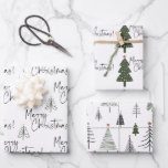 Merry Christmas Pine Trees Wrapping Paper Sheet<br><div class="desc">Beautiful and elegant black and white Merry Christmas wrapping paper with a bit of forest green is perfect for those who like a simple and minimalist aesthetic and a little bit of of colour. The pine Christmas trees have a tiny gold star. So pretty with the hand written script typography....</div>