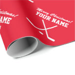 Merry Christmas red hockey player sports Wrapping Paper<br><div class="desc">Merry Christmas red hockey player sports Wrapping Paper. Custom name gift wrap rolls with crossed ice hockey sticks and puck. Sporty Holiday design for kids and adults. Also great for Birthday and other occasions.</div>