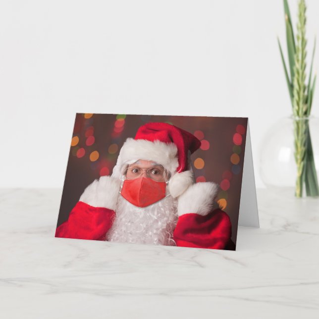 Merry Christmas Santa Claus Putting on Face Mask Holiday Card (Front)