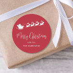 Merry Christmas Santa Sleigh Red Classic Round Sticker<br><div class="desc">Fun and festive red sticker for your Christmas holiday cards and gifts featuring a white silhouette of reindeers flying Santa's sleigh through air,  "Merry Christmas" in a stylish white script and your name in simple modern white typography.</div>