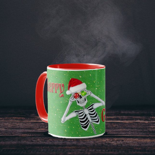 Merry Christmas Silly Skeleton Ornament Eyes Hat Mug (Fun Skeleton Ornament eyes Red Merry Christmas text on Green with gold flecks coffee or tea mug.)