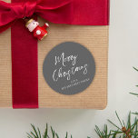 Merry Christmas Simple Minimalist Script Snowflake Classic Round Sticker<br><div class="desc">A Green Snowflake pattern with green against a grey background. Christmas holiday modern elegant cute, simple traditional merry Christmas, classic grey white chic typography, minimalist green snowflake pattern, minimal winter contemporary style, a modern hand lettering script font, whimsical typography template, classic family name calligraphy, Christmas holiday party favour gift, Christmas...</div>