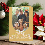 Merry Christmas Simple Modern Coquette Bow Photo Holiday Card<br><div class="desc">Merry Christmas Simple Modern Coquette Bow Photo Folded Holiday Card Christmas Cards features a simple design with your favourite photo with the text overlay "Merry Christmas" in modern calligraphy script typography accented with a trendy white bow on a gold background. Personalised your names or custom text below and your custom...</div>