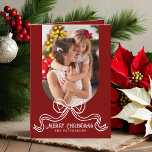 Merry Christmas Simple Modern Coquette Bow Photo Holiday Card<br><div class="desc">Merry Christmas Simple Modern Coquette Bow Photo Folded Holiday Card Christmas Cards features a simple design with your favourite photo with the text overlay "Merry Christmas" in modern calligraphy script typography accented with a trendy white bow on a red background. Personalised your names or custom text below and your custom...</div>