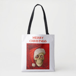 Merry Christmas. Skull wearing Santa hat Tote Bag