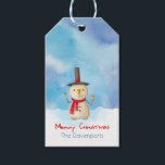 Merry Christmas Snowman Waving And Smiling Gift Tags<br><div class="desc">Personalised gift tag with a cute snowman illustration. He is wearing a black stovepipe hat, holding a classic corn cob pipe, and wearing a red scarf. Standing in the cold white snow smiling and waving hello. The background is composed of a watercolor sky with blue and purple colours blending and...</div>