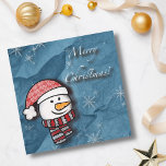 Merry Christmas, snowman with knitted clothes<br><div class="desc">A beautiful little snowman wearing white and red knitted clothes on a blue paper . Perfect to wish merry Christmas to the little ones.</div>
