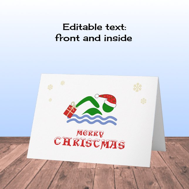 Merry christmas swimmer bringing gift holiday card (Creator Uploaded)
