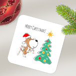 Merry Christmas Tree Cute Puppy Dog Santa Hat Square Sticker<br><div class="desc">This Merry Christmas Square Sticker features a cartoony illustration of cute Puppy in Santa hat preparing for Christmas celebration. Little funny doggy is holding decoration lights trying to figure out the place for them on the Christmas tree. Great Xmas gift for the dog lover!</div>