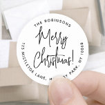 Merry Christmas Trendy Script Round Return Address Classic Round Sticker<br><div class="desc">Add a stylish finishing touch to holiday card envelopes with chic Merry Christmas return address envelope seals. All wording on this template is simple to customise or delete. The black and white design features modern handwritten script calligraphy and minimalist typography address in a circle. These unique round return address labels...</div>