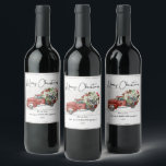 Merry Christmas Vintage Red Truck Family Holiday  Wine Label<br><div class="desc">Merry Christmas Vintage Red Truck Family Holiday Wine Labels - feature a red vintage truck filled with Christmas botanicals, holly berries and a black and white bow on a white weathered wood background. Merry Christmas is in a pretty script font. Label is personalised with your family name. Labels are part...</div>