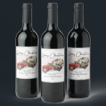 Merry Christmas Vintage Red Truck Family Holiday  Wine Label<br><div class="desc">Merry Christmas Vintage Red Truck Family Holiday Wine Labels - feature a red vintage truck filled with Christmas botanicals, holly berries and a black and white bow on a white weathered wood background. Merry Christmas is in a pretty script font. Label is personalised with your family name. Labels are part...</div>