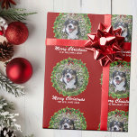 Merry Christmas Wreath Custom Dog Photo Red Wrapping Paper<br><div class="desc">Beautiful custom pet Christmas wrapping paper featuring a green holiday wreath on a red background. Replace with your dog's photo in the centre of the wreath or add a personalised cat picture for your friends and family. Merry Christmas is written in white. Customise with your own text underneath.</div>