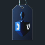 Metallic Blue Dreidel Gift Tags<br><div class="desc">A modernistic,  metallic blue dreidel against a dark,  night-like background.  Two of the Hebrew letters found on a dreidel,  nun and shin,  glow brightly.</div>