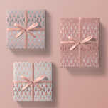 Metallic Rose Gold Platinum Silver Christmas Trees Wrapping Paper Sheet<br><div class="desc">This assortment of holiday wrapping paper sheets features simulated metallic glitter faux foil ornate christmas pine tree silhouettes in rose gold and platinum silver scattered over a beautiful solid tones of mauve,  rose quartz pink,  and platinum grey</div>