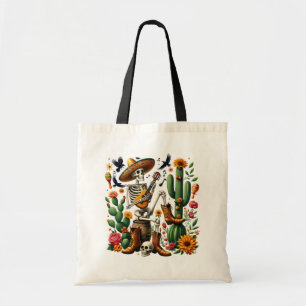 Mexican skeleton playing guitar among cacti tote bag