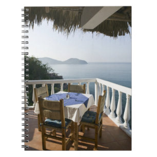 Mexico, Guerrero, Zihuatanejo. Cafe Table over Notebook