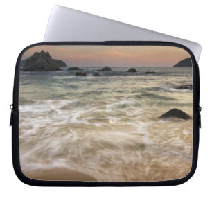 Mexico, Guerrero, Zihuatanejo.  Surf along a Laptop Sleeve