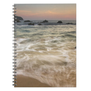 Mexico, Guerrero, Zihuatanejo. Surf along a Notebook