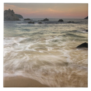 Mexico, Guerrero, Zihuatanejo. Surf along a Tile