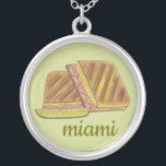 Miami Florida Ham Swiss Cheese Cuban Sandwich Silver Plated Necklace<br><div class="desc">Illustration features a delicious Cuban sandwich--a Miami, Florida favourite! This tasty pressed sandwich, a version of a classic ham and cheese, has Cuban bread, ham, Swiss cheese, pickles, mustard, and sometimes salami. Great for your favourite Floridian! This Cuban sandwich foodie design is also available on other products. Lots of other...</div>