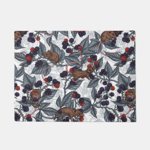 Mice and blackberries on white doormat