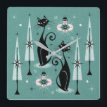 Mid Century Atomic Kitty Christmas ©studioxtine Square Wall Clock<br><div class="desc">My original vector illustration of vintage inspired cats,  Christmas trees,  ornaments,  snow and starbursts,  in black,  pink,  shades of muted teal and a hint of ivory. ©Christine Duffield 2019-21.</div>