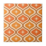 Mid Century Atomic Starbursts on Orange  Ogee  Ceramic Tile<br><div class="desc">This is elegant mid century modern atomic retro starbursts pattern placed on orange and amber ogee ovals on beige background.  It's great looking ceramic tile for anyone who love retro geometric designs</div>