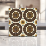 Mid-Century Modern Concentric Circles Ceramic Tile<br><div class="desc">This mid-century modern tile features bold concentric circles in earthy tones of brown,  mustard yellow,  and cream,  accented by minimalist geometric ovals. The retro-inspired pattern brings warmth and character to any backsplash,  accent wall,  or interior design project. Perfect for creating a vintage-inspired space with a stylish and contemporary twist.</div>