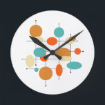Mid Century Modern Retro Orange Turquoise Circles Round Clock<br><div class="desc">This turquoise,  orange,  cream,  and black retro geometric circles and lines mid century clock will not only add a pop of color to the room,  but will be an original art piece as well.</div>