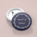 Midnight Blue, Blush Pink and Sage Maid of Honour 6 Cm Round Badge<br><div class="desc">Identify the key players at your bridal shower with our sweetly chic floral buttons. Design features a midnight blue background and a wreath of pale blush pink flowers and sage green leaves,  and "Maid of Honour" in coordinating pastel pink italic lettering.</div>