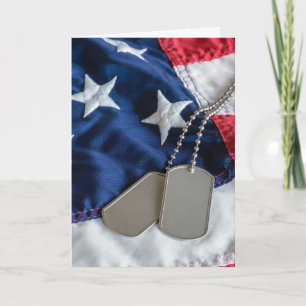 military dog tags on flag card