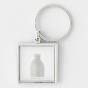 Milk bottle on white background key ring