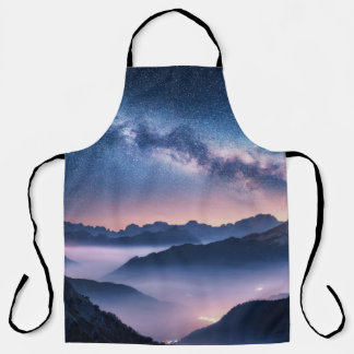 Milky Way over mountains in fog at night in summer Apron